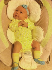 One month! Dressed up like a doll